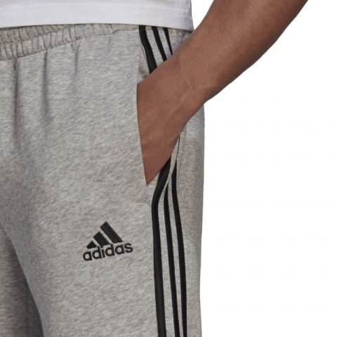 Spodnie adidas Essentials Tapered Cuff 3 Stripes M GK8976 Spodnie adidas Essentials Tapered Cuff 3 Stripes M GK8976