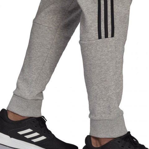 Spodnie adidas Essentials Tapered Cuff 3 Stripes M GK8976 Spodnie adidas Essentials Tapered Cuff 3 Stripes M GK8976