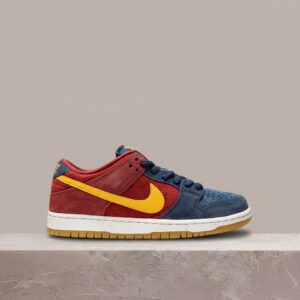 Nike SB Dunk Low Barcelona, drop sierpień 2021, asymetria granat bordo, złote akcenty, skate silhouette, DJ0606-400